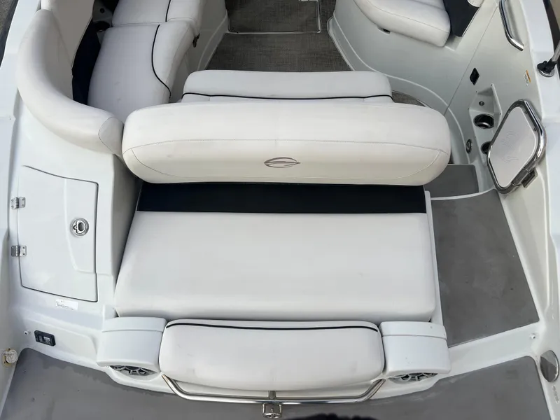 Slide: The Image of 2016 Crownline 270 SS boat interior with white leather seating. - 32