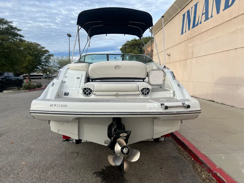 Slide: The Image of 2016 Crownline 270 SS boat with black canopy, rear view. - 7
