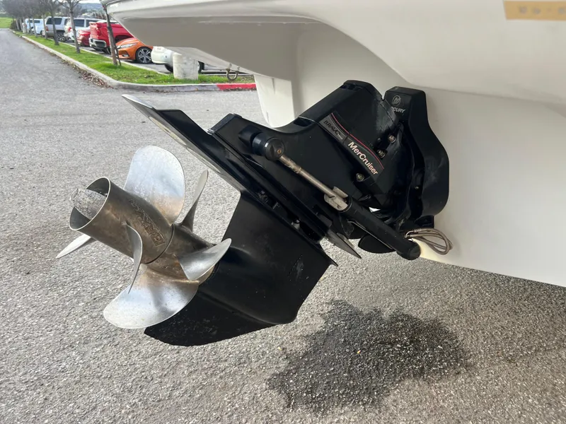 Slide: The Image of 2016 Crownline 270 SS boat propeller and outdrive on pavement. - 8