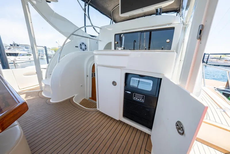 Slide: The Image of 2004 Meridian 459 Motor Yacht interior with wooden flooring and built-in appliances. - 14