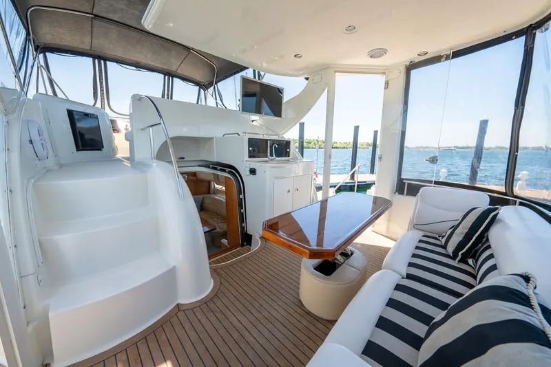 Slide: The Image of Interior of a 2004 Meridian 459 Motor Yacht with seating and dining area. - 25