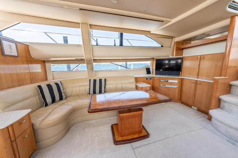 Slide: The Image of Luxurious interior of a 2004 Meridian 459 Motor Yacht with leather seating and wooden table. - 32