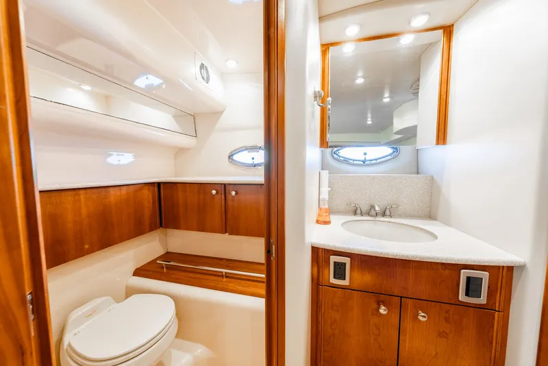 Slide: The Image of Luxurious bathroom in 2004 Meridian 459 Motor Yacht with wood cabinetry and modern fixtures. - 36