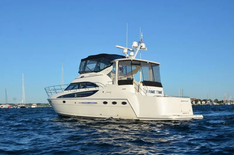 Slide: The Image of 2004 Meridian 459 Motor Yacht on open water, showcasing sleek design and luxury features. - 43