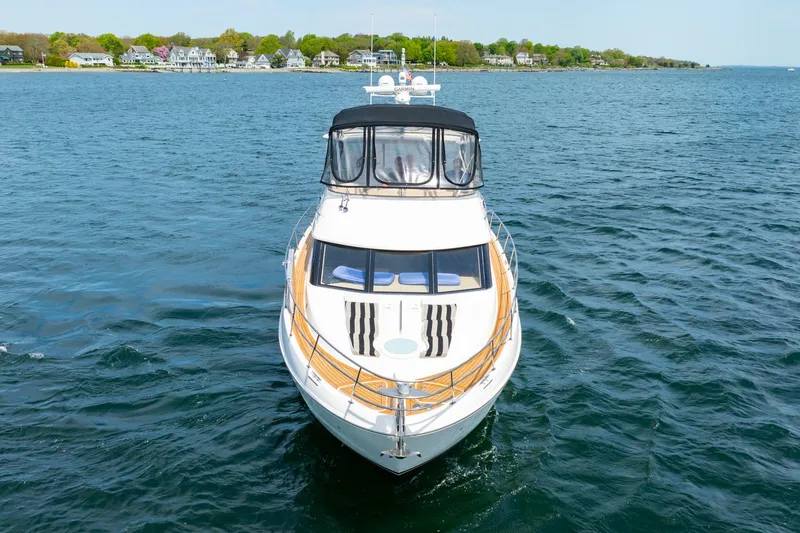 Slide: The Image of 2004 Meridian 459 Motor Yacht cruising on open water. - 6