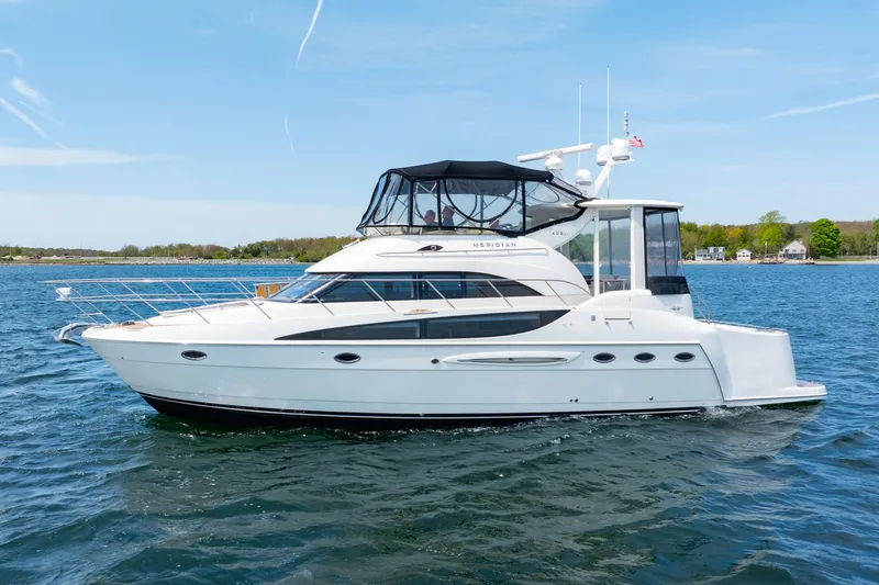 Slide: The Image of 2004 Meridian 459 Motor Yacht cruising on a calm lake. - 9