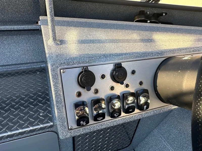 Slide: The Image of Control panel of 2024 KingFisher 2025 Falcon boat with switches and outlets. - 19
