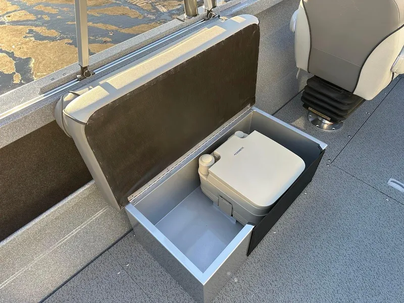 Slide: The Image of KingFisher 2025 Falcon boat with built-in storage compartment and portable toilet. - 26