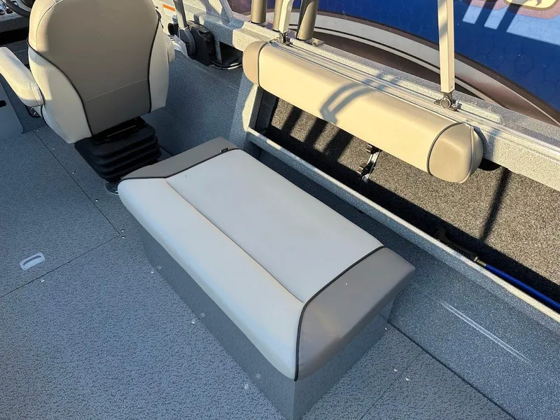 Slide: The Image of Interior seating of 2025 KingFisher Falcon boat, featuring gray and beige upholstery. - 28