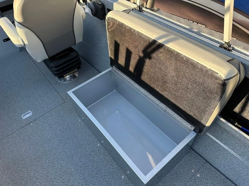 Slide: The Image of KingFisher 2025 Falcon boat interior with open storage compartment, 2024 model. - 29