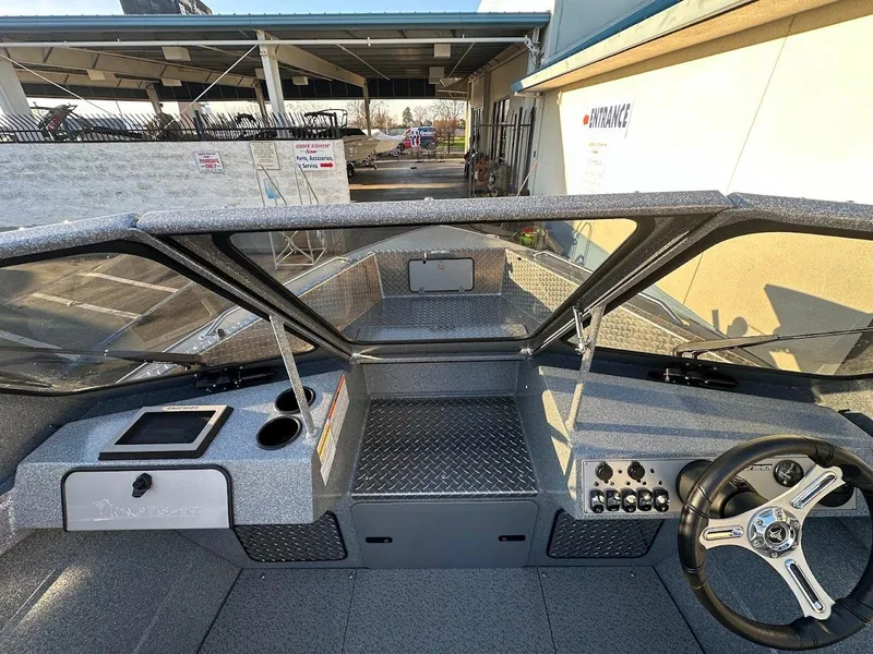 Slide: The Image of Interior view of 2024 KingFisher 2025 Falcon boat cockpit with steering wheel and dashboard. - 30