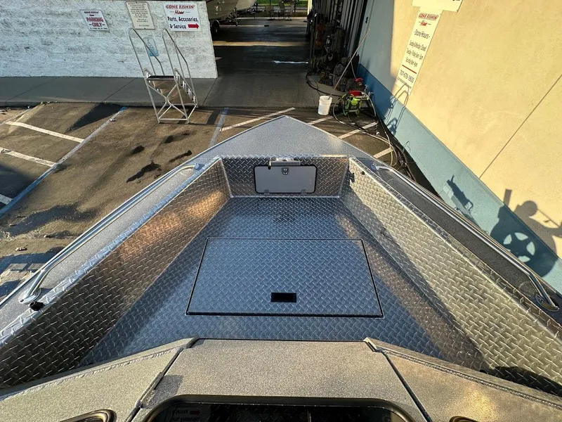 Slide: The Image of 2024 KingFisher 2025 Falcon boat deck with diamond plate flooring. - 31