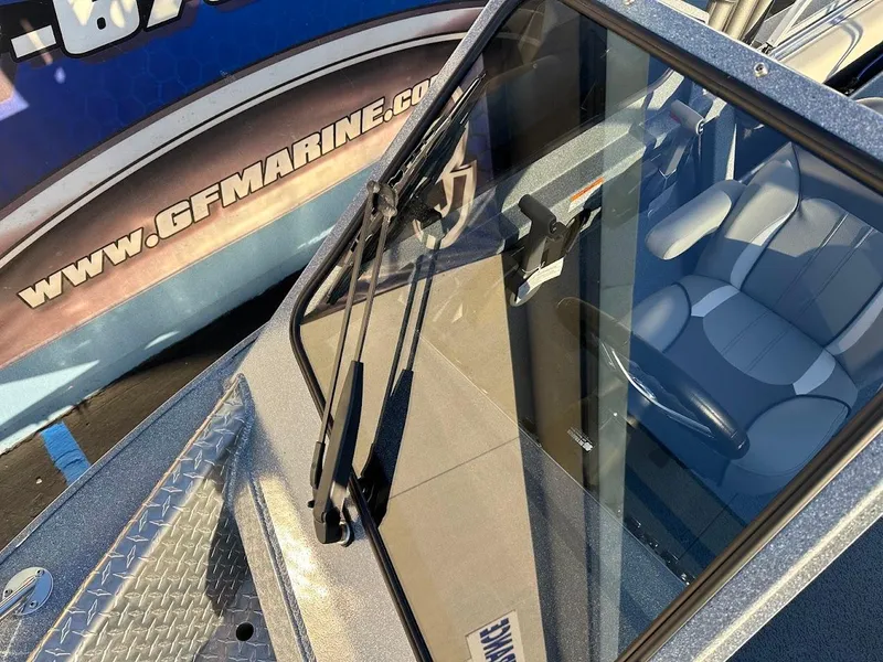 Slide: The Image of KingFisher 2025 Falcon boat windshield and interior, showcasing modern design and comfort. - 32