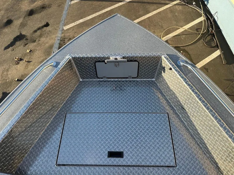 Slide: The Image of 2024 KingFisher 2025 Falcon boat deck with diamond plate flooring. - 33