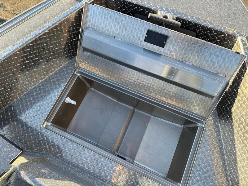 Slide: The Image of Open storage compartment in 2024 KingFisher 2025 Falcon boat with diamond plate design. - 34