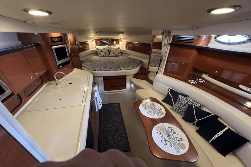 Slide: The Image of Luxurious interior of 2005 Sea Ray 340 Sundancer yacht with cozy seating and modern amenities. - 28