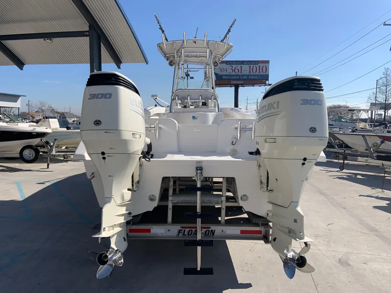 Slide: The Image of 2018 Twin Vee 310 GF boat with dual Suzuki 300 outboard engines. - 11