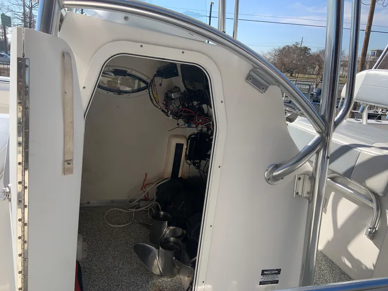 Slide: The Image of 2018 Twin Vee 310 GF boat interior with open hatch and visible wiring. - 3