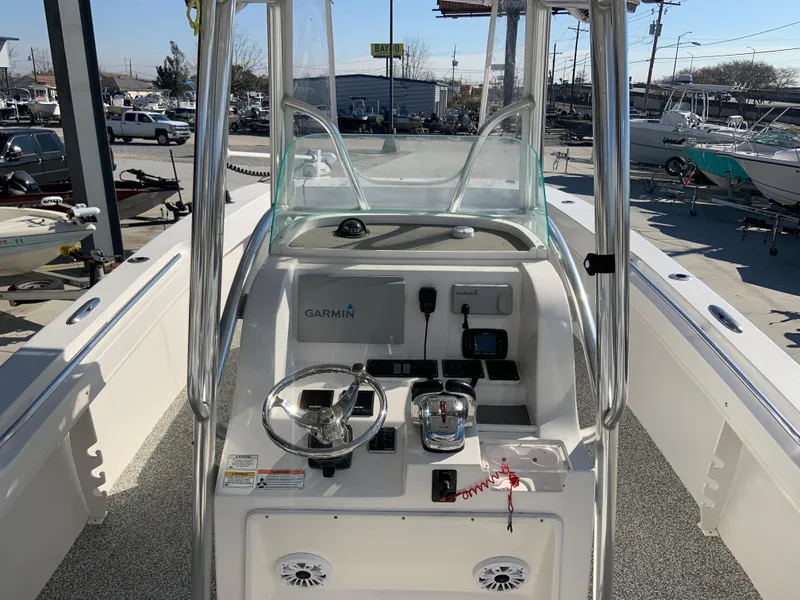 Slide: The Image of 2018 Twin Vee 310 GF boat console with Garmin electronics and steering wheel. - 5