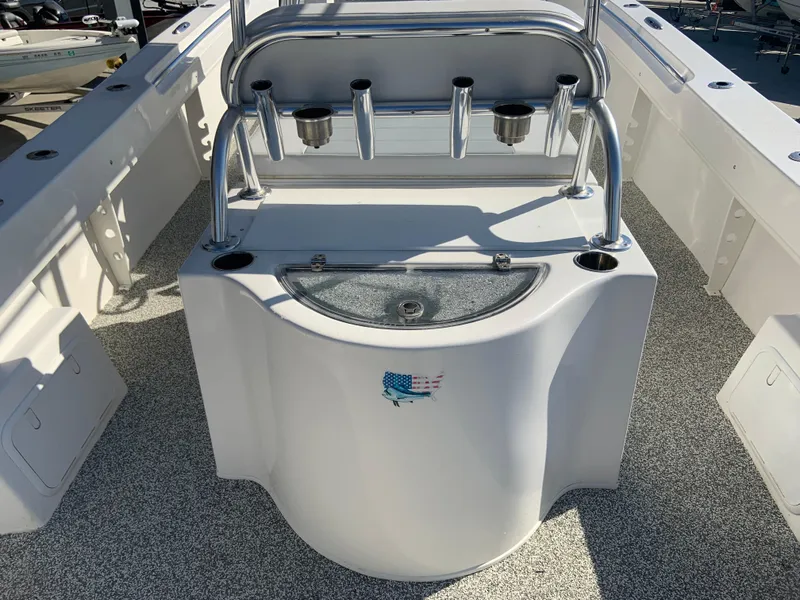 Slide: The Image of 2018 Twin Vee 310 GF boat interior with rod holders and storage compartments. - 6
