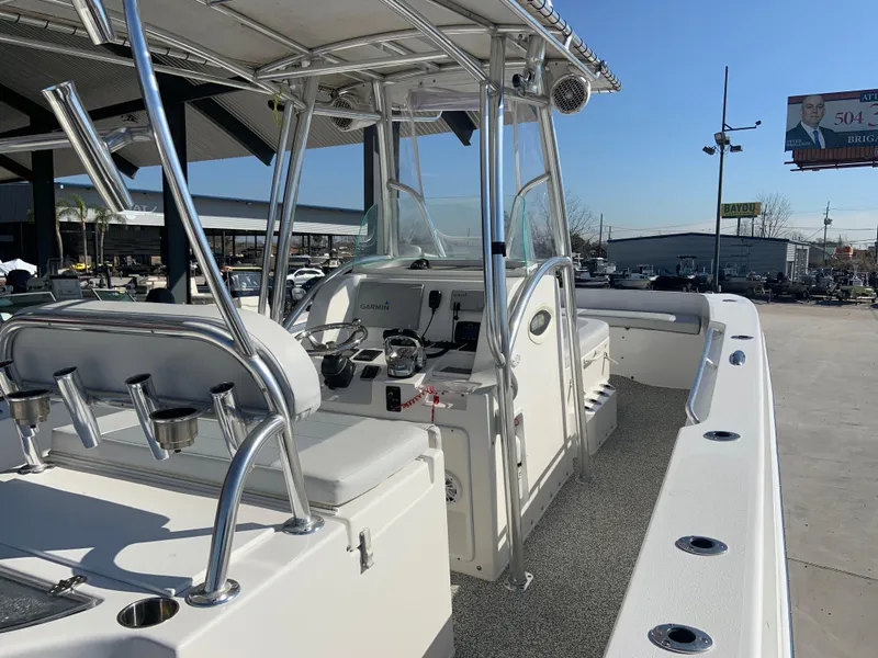 Slide: The Image of 2018 Twin Vee 310 GF boat with center console and stainless steel rod holders. - 9