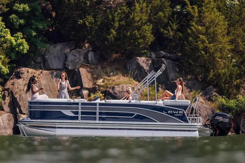 Slide: The Image of 2024 Lowe SS210 pontoon boat with people enjoying a sunny day on the water. - 15