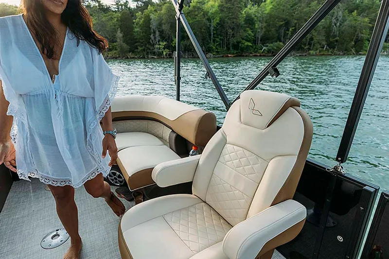 Slide: The Image of 2024 Lowe SS210 WT boat interior with luxury seating on a lake. - 12