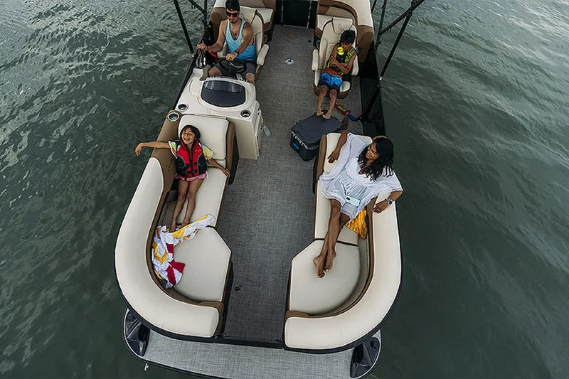 Slide: The Image of Family enjoying a day on a 2024 Lowe SS210 WT pontoon boat. - 14
