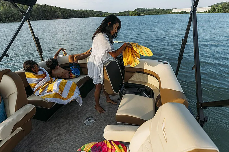 Slide: The Image of Family enjoying a day on a 2024 Lowe SS210 WT boat on a lake. - 15