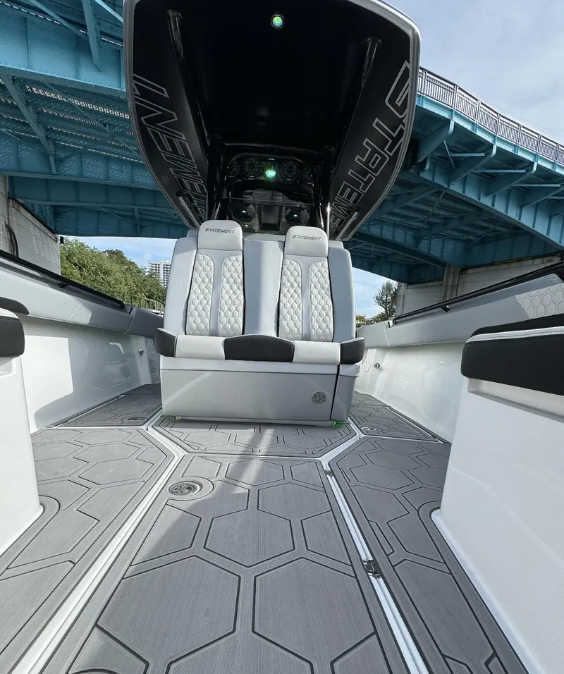 Slide: The Image of 2024 Statement 350 boat interior with luxury seating under a blue bridge. - 6