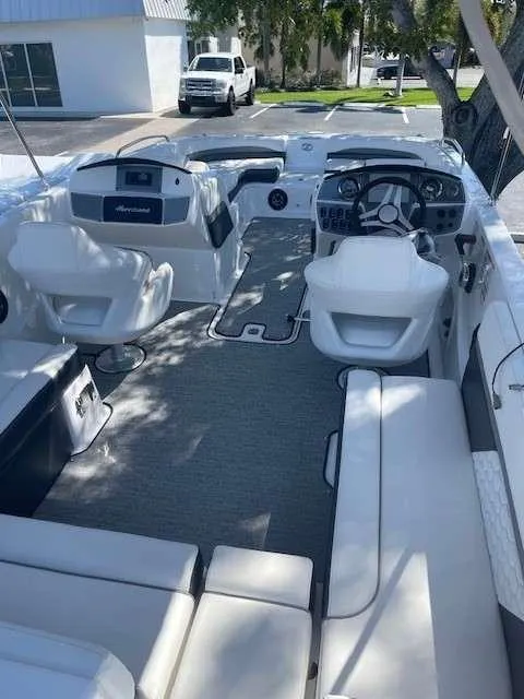Slide: The Image of 2024 Hurricane 218 SS boat interior with white seating and modern dashboard. - 11