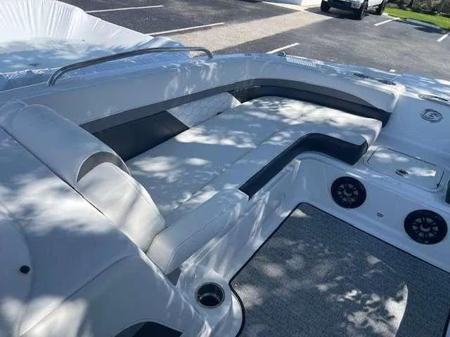 Slide: The Image of 2024 Hurricane 218 SS boat interior with cushioned seating and built-in speakers. - 13