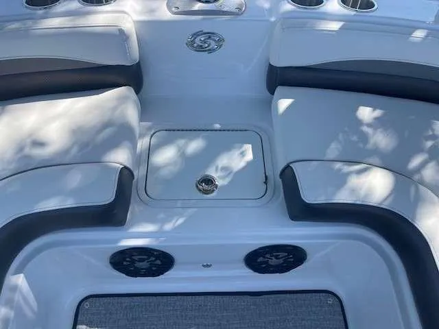 Slide: The Image of 2024 Hurricane 218 SS boat interior seating and storage compartment. - 14