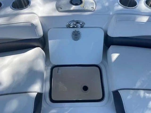 Slide: The Image of 2024 Hurricane 218 SS boat seating area with storage compartment. - 15