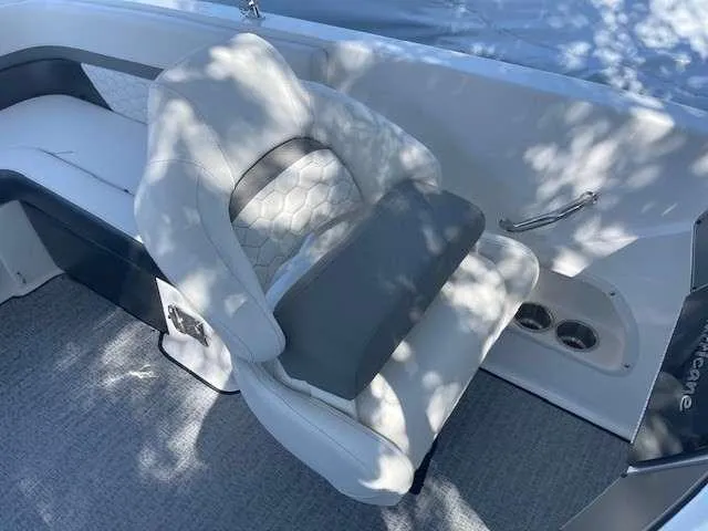 Slide: The Image of 2024 Hurricane 218 SS boat interior with white and gray seating. - 16