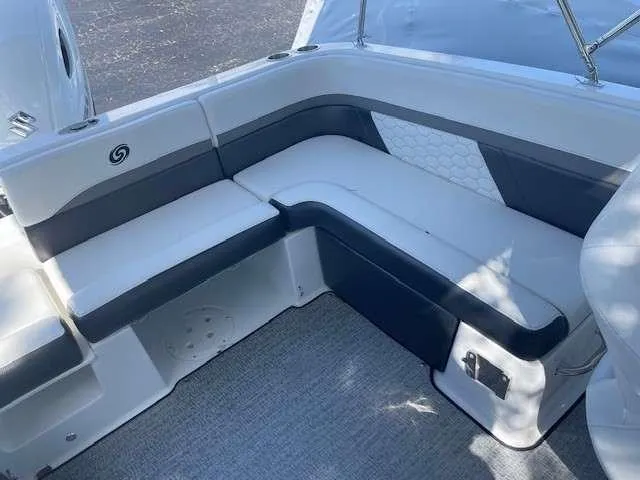 Slide: The Image of 2024 Hurricane 218 SS boat interior seating with white and gray upholstery. - 17