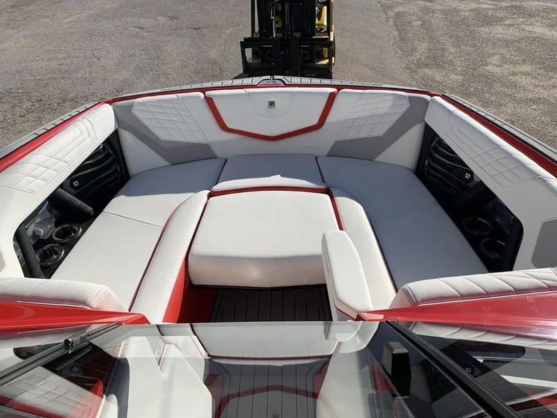 Slide: The Image of 2024 Nautique Super Air Nautique G23 boat interior with white and red seating. - 4