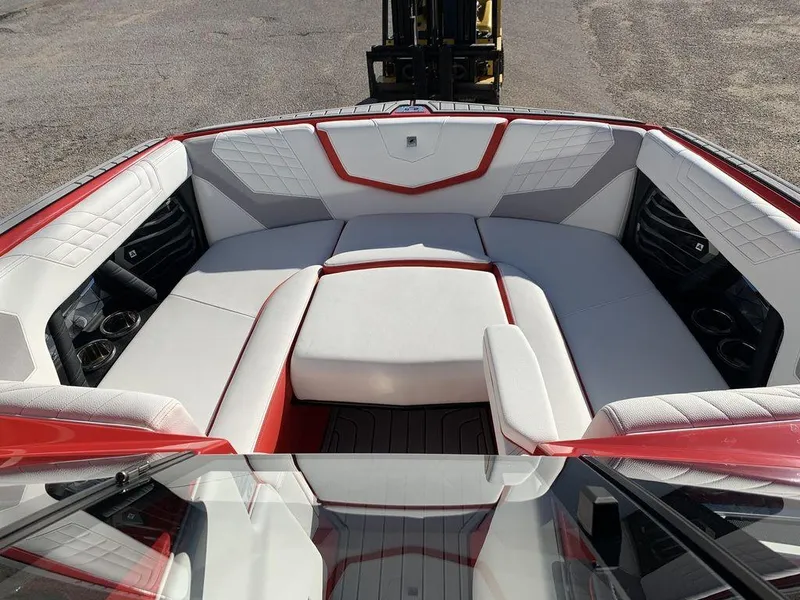 Slide: The Image of 2024 Nautique Super Air Nautique G23 boat interior with white and red seating. - 5