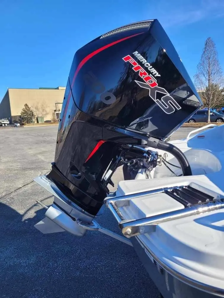 Slide: The Image of 2024 Tahoe T21 boat with Mercury Pro XS outboard motor. - 2