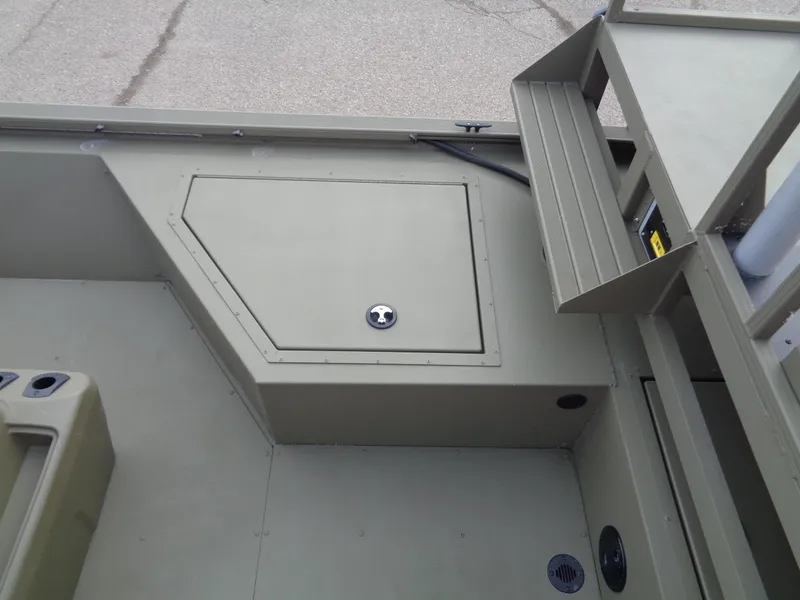 Slide: The Image of 2024 Tracker Grizzly 2072 CC Sportsman boat interior storage compartment. - 11