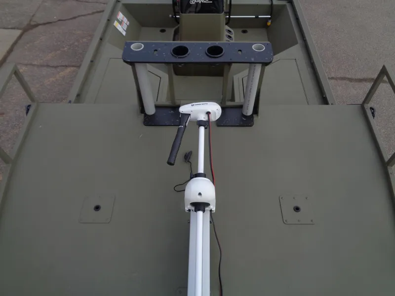 Slide: The Image of 2024 Tracker Grizzly 2072 CC Sportsman boat interior with trolling motor and rod holders. - 8