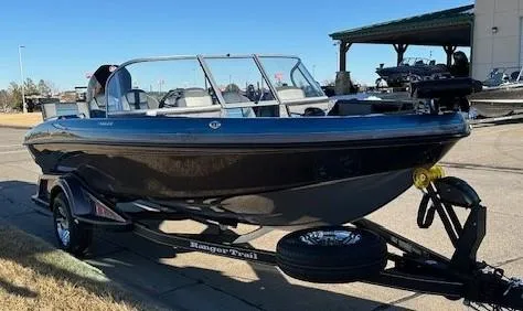 Slide: The Image of 2024 Ranger 1880MS boat on a trailer, parked outdoors. - 3