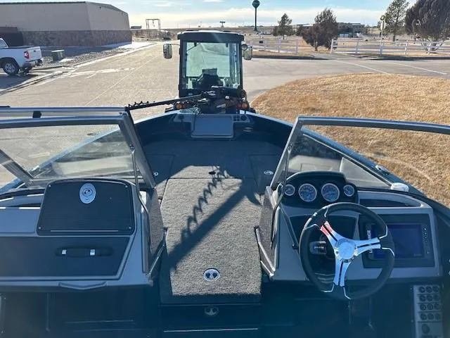 Slide: The Image of 2024 Ranger 1880MS boat interior with steering wheel and dashboard. - 4