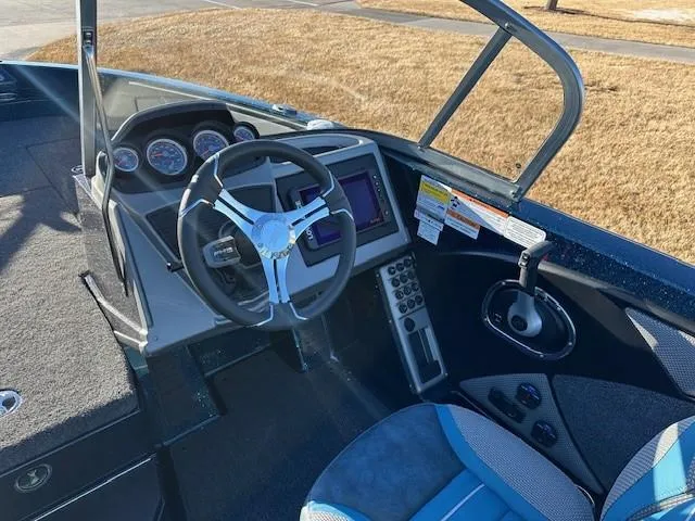 Slide: The Image of 2024 Ranger 1880MS boat cockpit with steering wheel and control panel. - 6