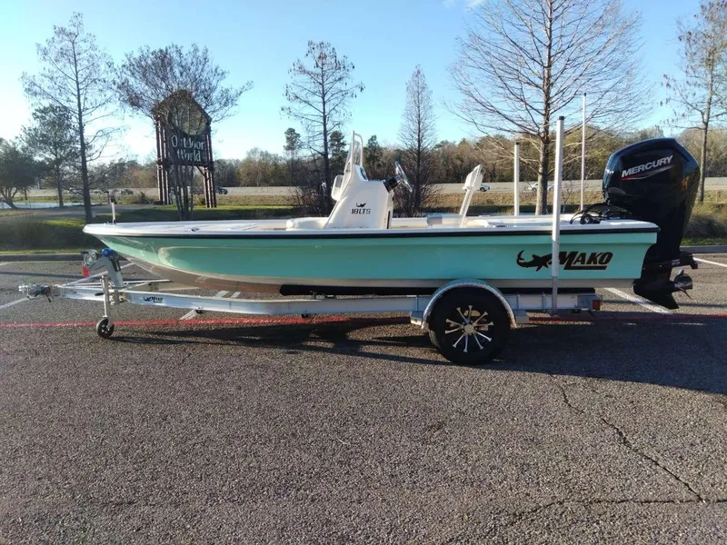 Slide: The Image of 2024 Mako 18 LTS boat on trailer with Mercury outboard motor. - 0