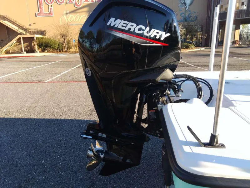 Slide: The Image of 2024 Mako 18 LTS boat with Mercury outboard motor in parking lot. - 3