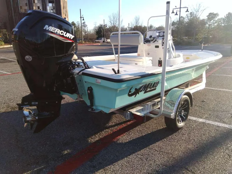 Slide: The Image of 2024 Mako 18 LTS boat with Mercury outboard motor in parking lot. - 4