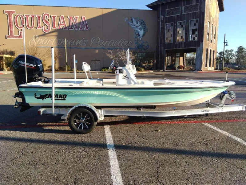 Slide: The Image of 2024 Mako 18 LTS boat on trailer in Louisiana parking lot. - 5