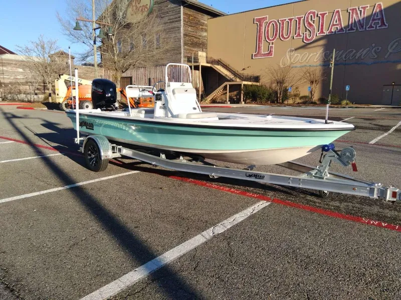 Slide: The Image of 2024 Mako 18 LTS boat on trailer in parking lot near Louisiana Sportsman's Paradise. - 6