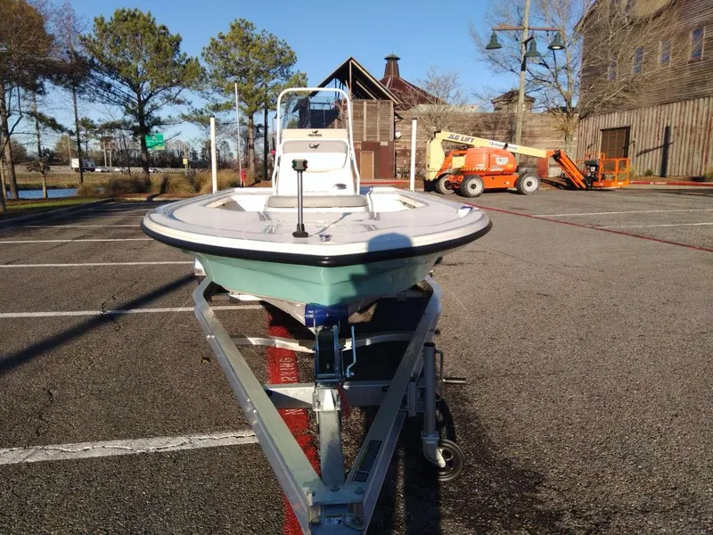 Slide: The Image of 2024 Mako 18 LTS boat on a trailer in a parking lot. - 7